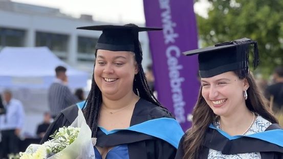 Proud students wearing their graduation gown