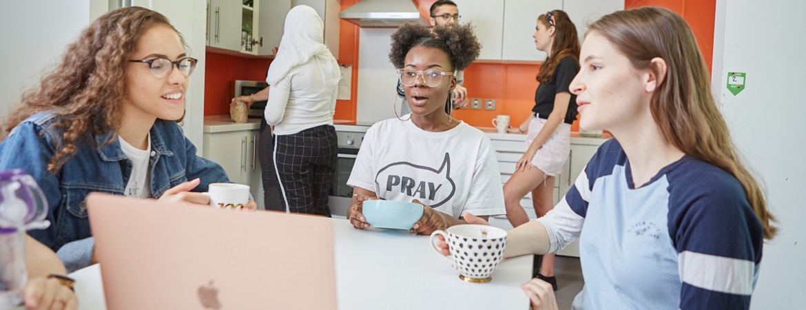 an image of students chatting in kitchen on campus at the University of Warwick