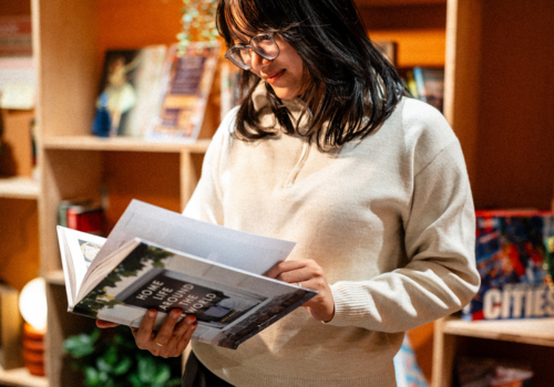 A student reading a book in The Nook