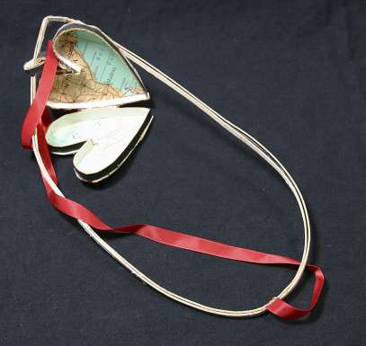 Locket and Gold Bow by Bill Woodrow
