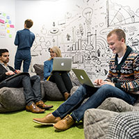 People working in a creative meeting space