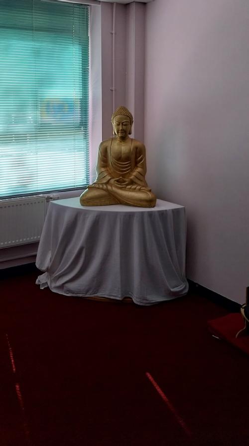 Interior of the Buddhist Room showing the image of Buddha