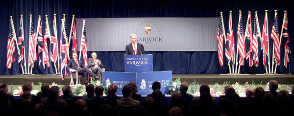 The President, Prime Minister and Vice Chancellor on stage in the Butterworth Hall.
