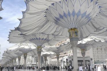 Piazza Umbrellas in Madinah in a state of partial opening (photograph courtesy of SL-Rasch) .