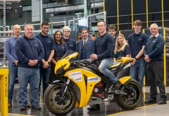 The full team of students and academics with the driver, Tom Weeden