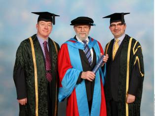 Oliver Sacks on receiving his honorary degree with his orator Professor Lawrence Young (right) and Warwick