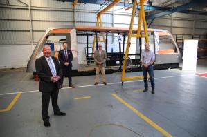 Caption: The frame of the Coventry Very Light Rail system with: Cllr Jim O’Boyle, Cabinet Member for Jobs and Regeneration, CCC, James Kempston, CEO, NP Aerospace, Rupert Symons, Director, TDI, Dr James Meredith, VLR project manager, WMG Credit: WMG, University of Warwick