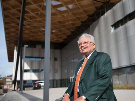 Caption: The Late Professor Lord Bhattacharyya with his building at WMG, University of Warwick  Credit: WMG, University of Warwick