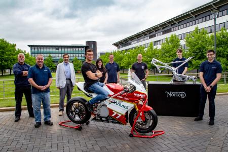 Caption: The finished electric racing bike ‘Frontier’ next to a model of the Norton Motorcycles frame it is built on. The full team from left to right are: Robert Driver – Battery Testing & Characterisation Engineer, David Cooper – Precision Engineer at WMG, Professor Dave Greenwood - CEO of WMG High Value Manufacturing Catapult, Tom Weeden – the professional rider for the team, Lee-Rose Jordan – Project Manager, Student Projects at WMG, Malcolm Swain – Lead Engineer a WMG, Martin Neczaj – Chief Chassis Engineer at Norton Motorcycles, James Grohmann –Lead Design Engineer (Student), Aman Surana – Chief Engineer of Warwick Moto team (Student)  Credit: Norton Motorcycles
