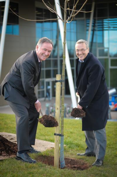 L-R: Councillor Andrew Day, Leader of Warwick District Council, joins Professor Stuart Croft, Vice-Chancellor of the University of Warwick, in planting the latest tree to form part of The Queen's Green Canopy at the University.
