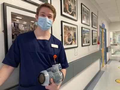 Warwick Medical School student Matthew Thompson at the exhibition of his photographs of staff at George Eliot Hospital.