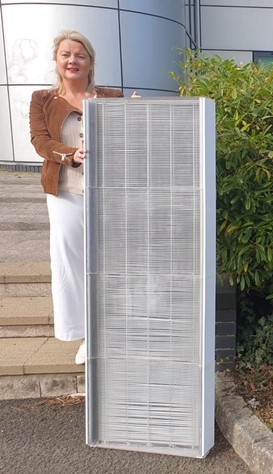 Caption: Christine Boyle, CEO of Senergy Ltd with the Solar Panel  Credit: WMG, University of Warwick 