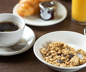 Continental breakfast options including cereals, croissants, coffee and juice.