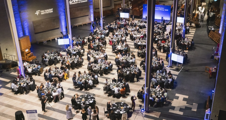 A large room filled with guests dining after a conference