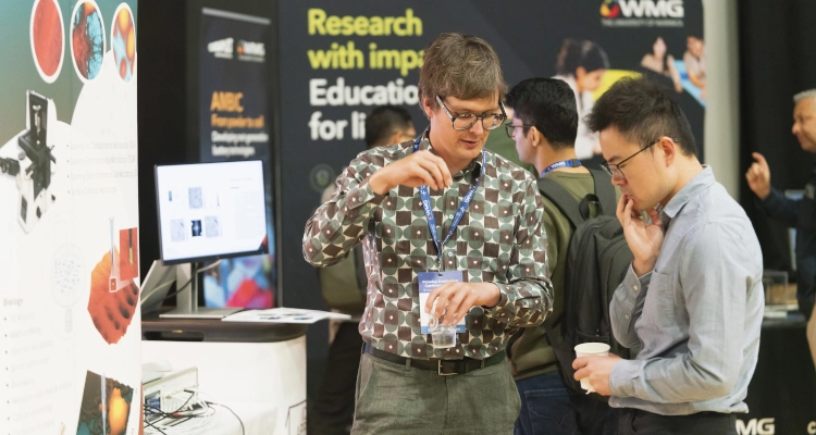 Two people talking to eachother at a conference