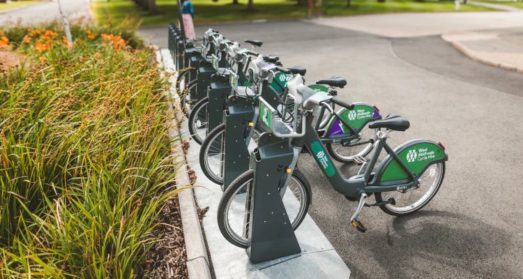 Electric bikes parked up together charging