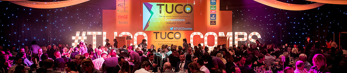 Large audience in front of stage at TUCO event