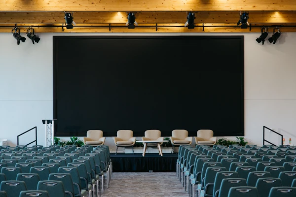A clickable image of the The Slate's event space set up for a conference that links to the meeting spaces gallery page