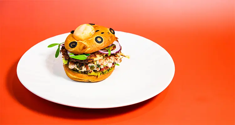 Burger with garnish on a plate