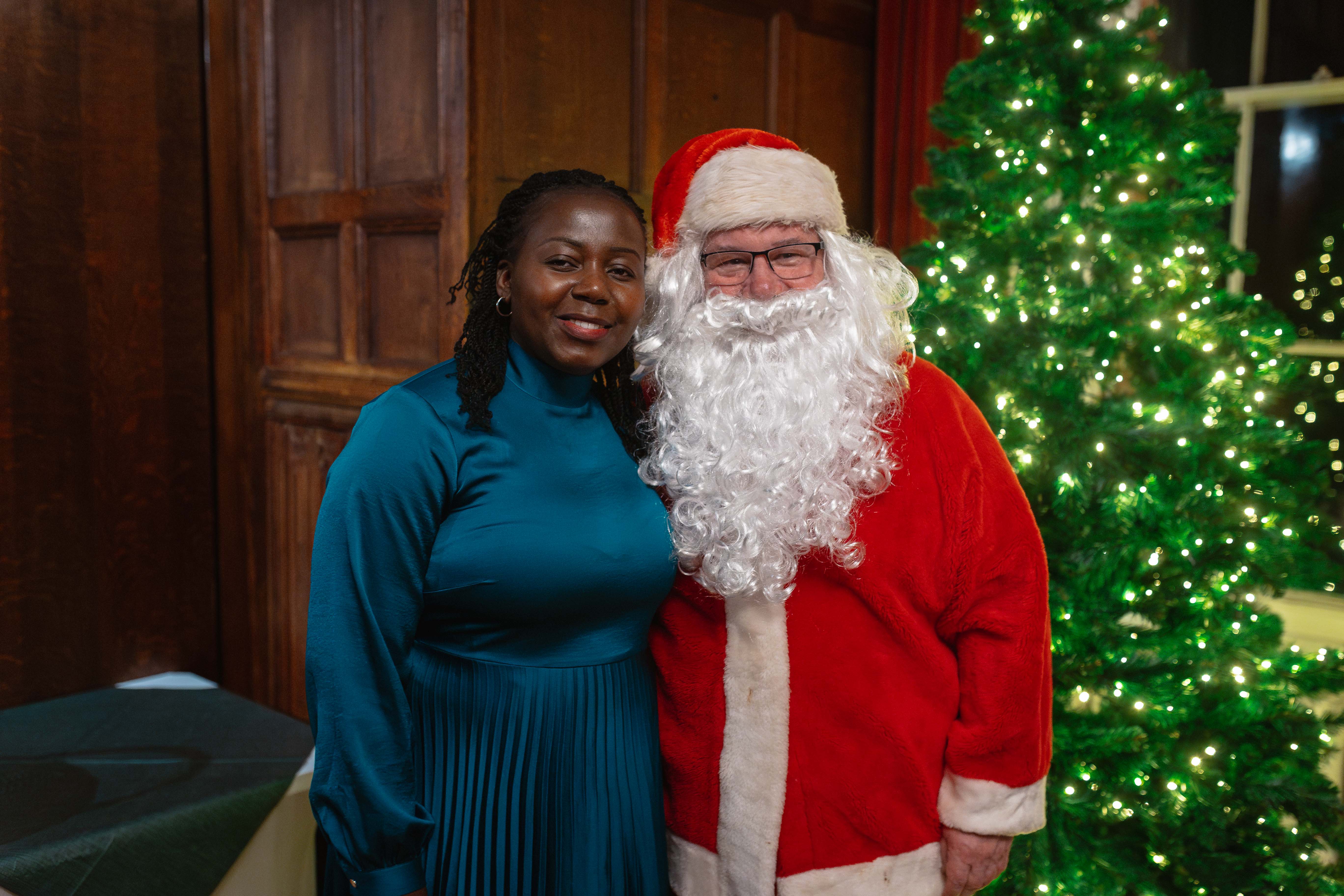 A photo with Father Christmas after enjoying the British Christmas dinner 