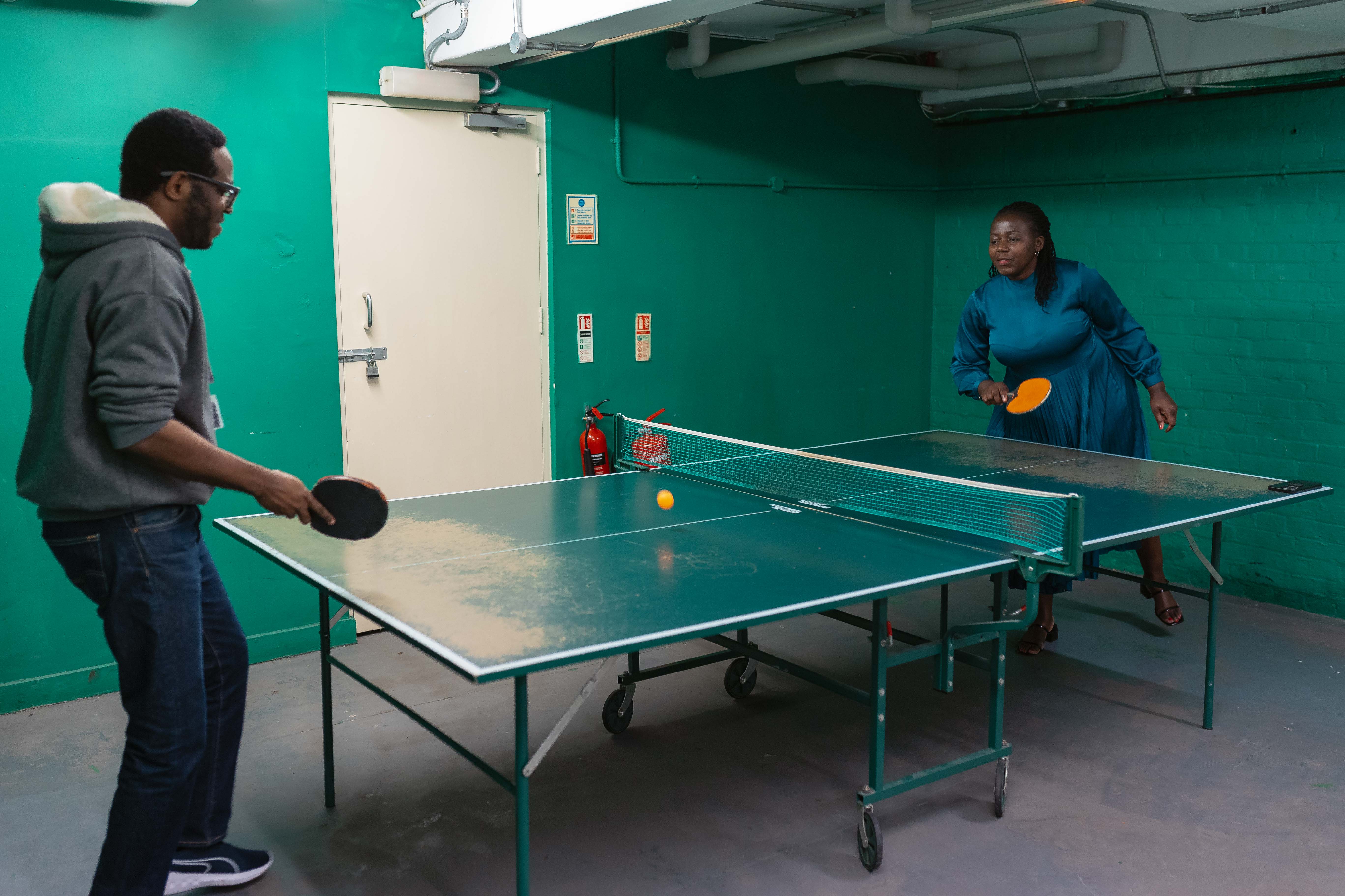 Playing table tennis with one of the conference participants 