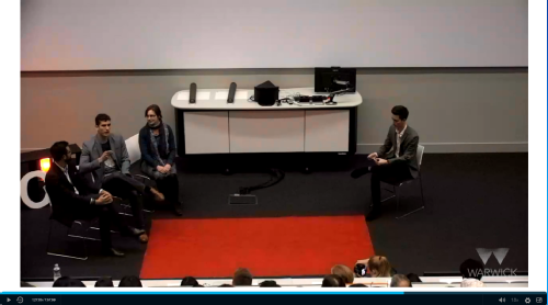A group of students sitting at the front of a lecture theatre