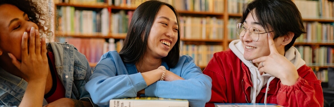 Students laughing in the library