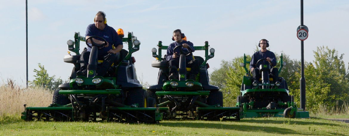 3 men mowing the lawn