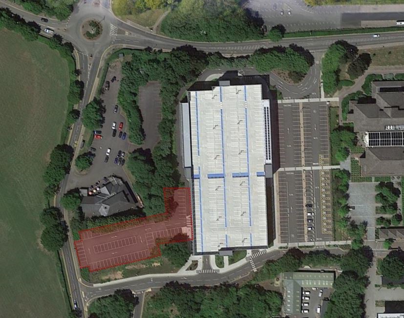 An aerial photo of the area where investigations will take place. The small outdoor car park to the rear of Kirby Corner Road is highlighted in recd. 