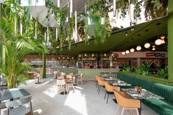 A seating area with leafy decor