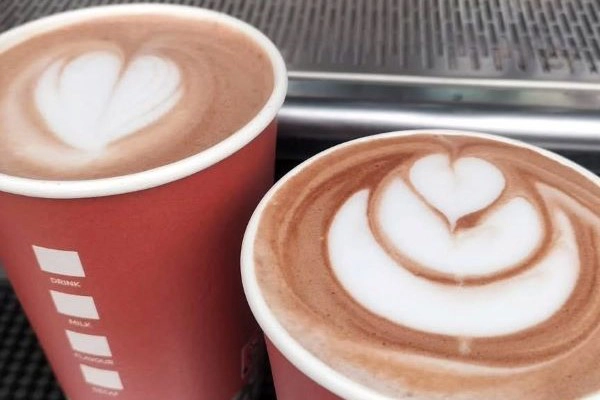 Two coffees in red cups