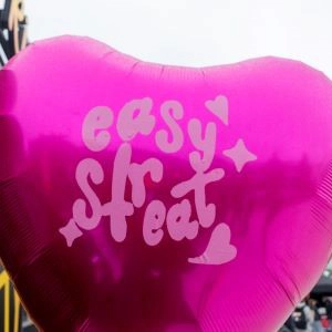 A Pink balloon with the Easystreat logo