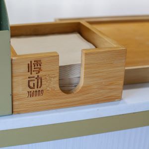 Napkin box with Jidong logo on it