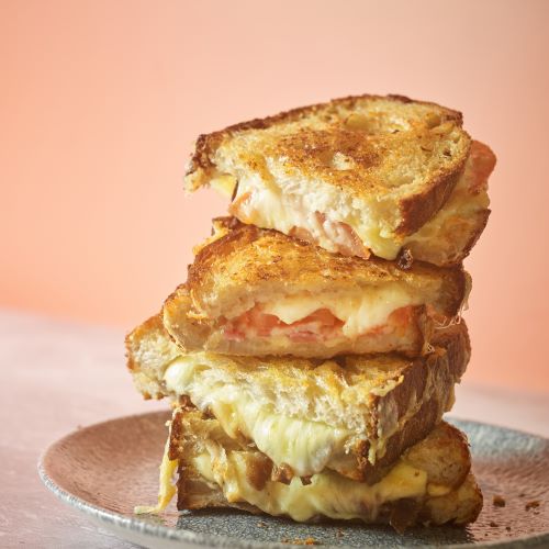 Two Grilled Cheese sandwiches stacked on top of each other