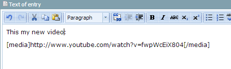 Screenshot of YouTube URL surrounded by media tags in the BlogBuilder text entry box