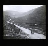 Two cyclists posing in the road, Glen Mallie, Scotland