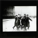 Carrying away injured victim in the demonstration, October 1923
