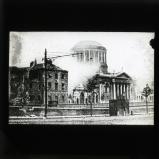 'The Four Courts as it appeared during the bombardment by National Troops. In the photograph a shell is seen exploding on the building.', 1922