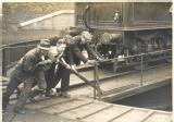 Volunteers turning an engine on the turntable at Kings Cross