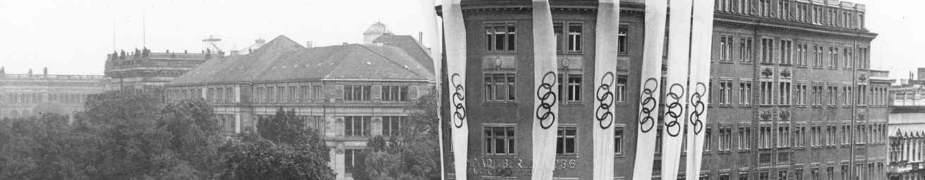 View of Berlin in 1936, including a building draped with banners which show the five Olympic rings