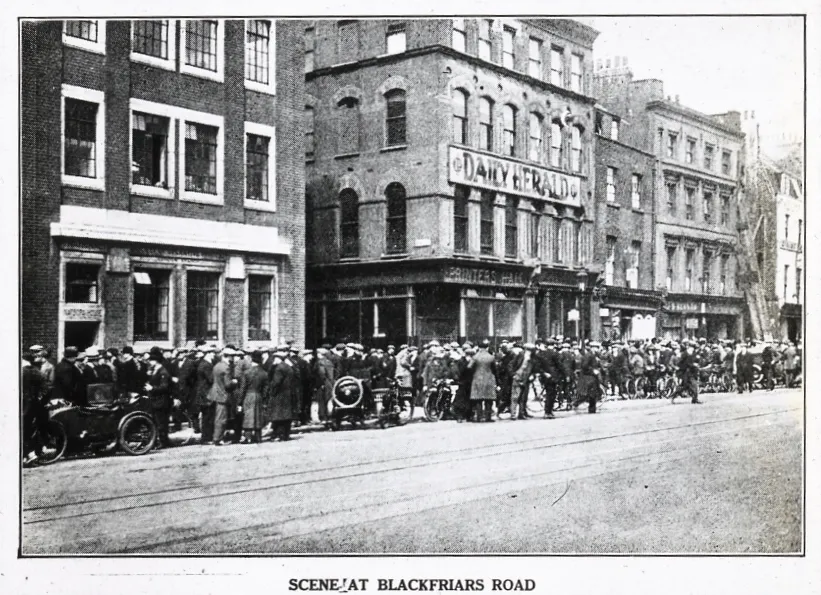 Photograph of a crowd outside the Daily Herald newspaper offices on Blackfriars Road, London.