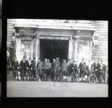 Cycle group posing in front of [Roman] building