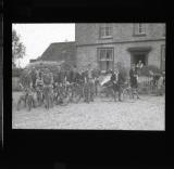 A group pose with their cycles outside a hotel