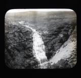 Waterfall flowing into crevasse
