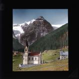 Small church with mountain in background