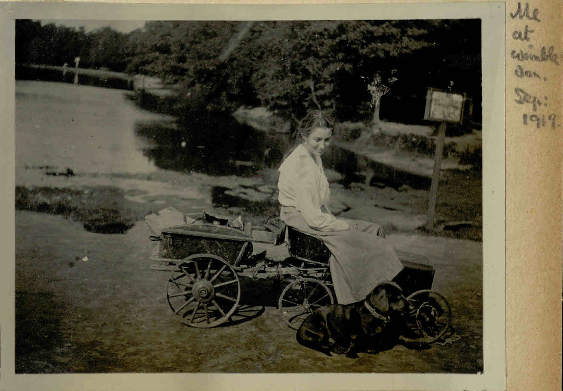Eileen Younghusband on a toy motor car at Wimbledon, 1917