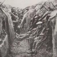 Soldiers sitting in trench