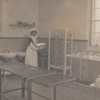 Nurse in early 20th century hospital