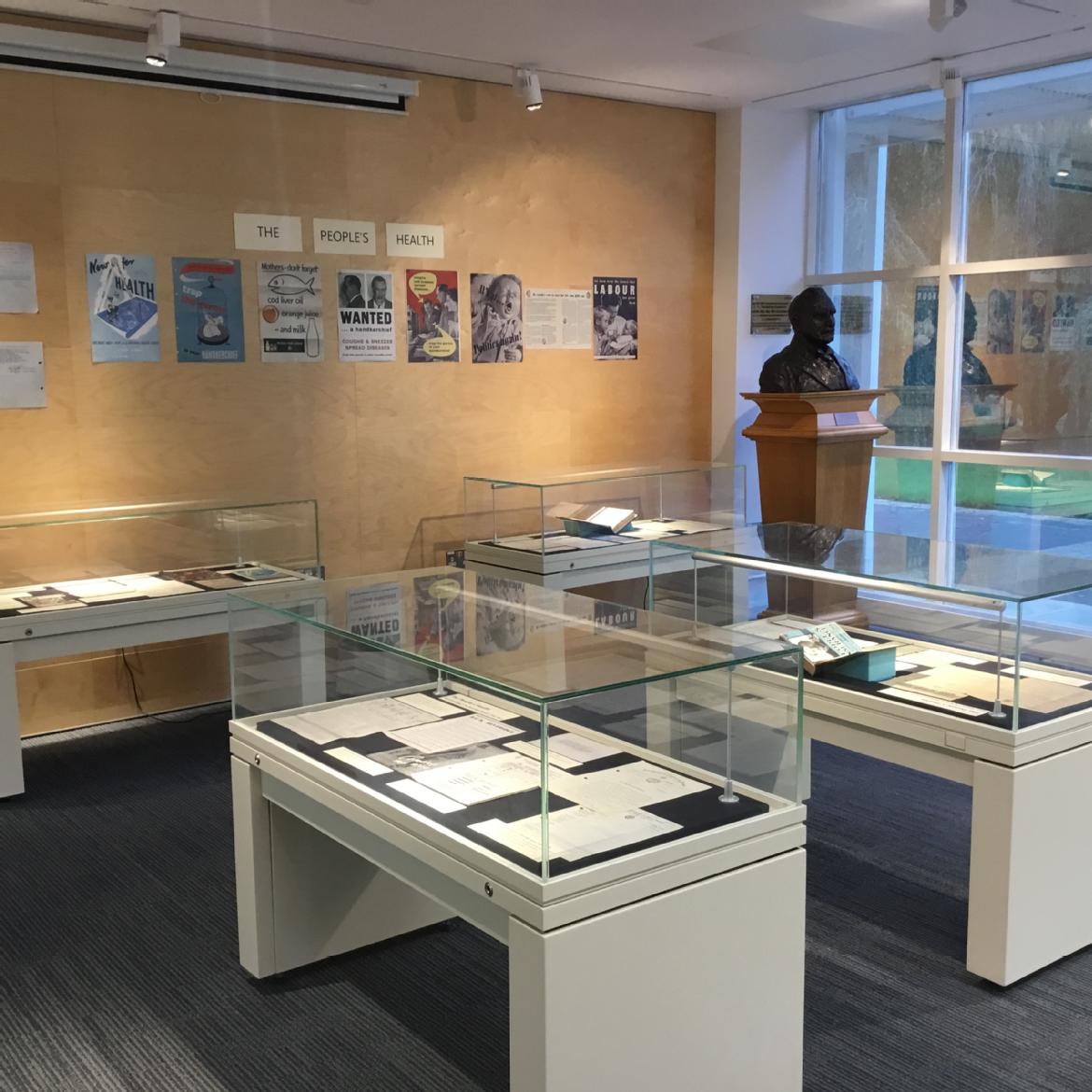 Photograph of the MRC exhibition space, showing four display cases.