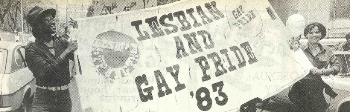 Image of two people carrying a 'Lesbian and Gay Pride 83' banner